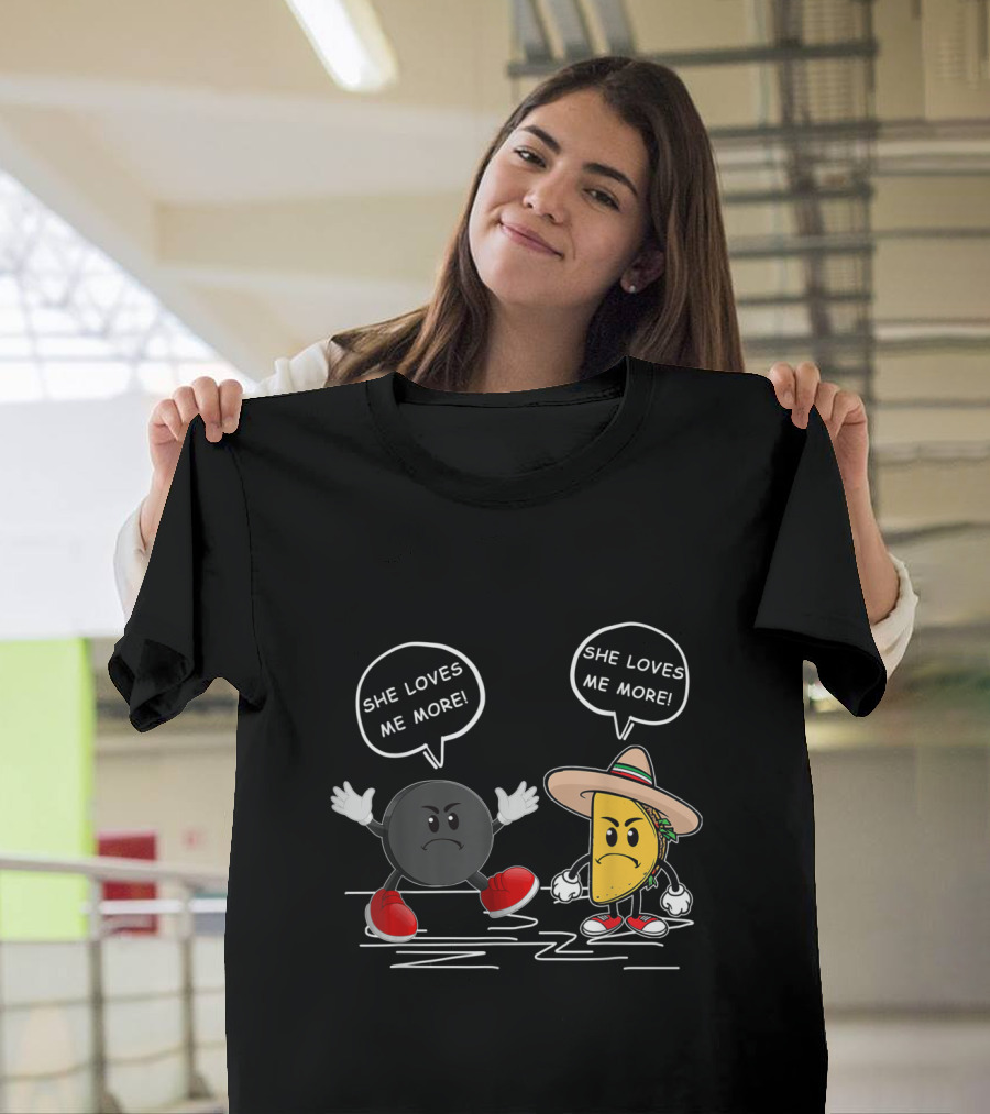 She Loves Me More: Playful Hockey Puck Versus Taco Showdown T-Shirt