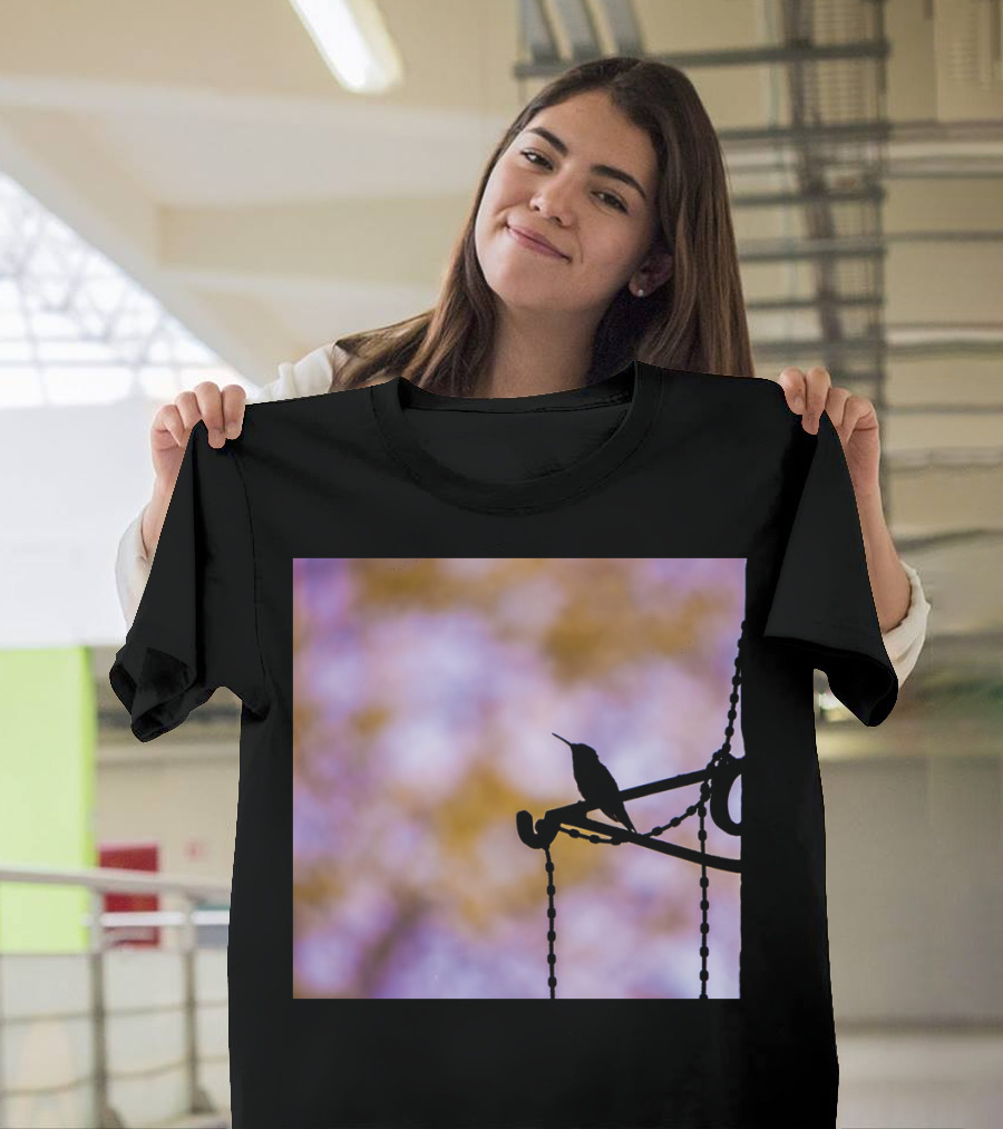 The Visitor Silhouette Bird on Chain Perch with Soft Nature Background T-Shirt