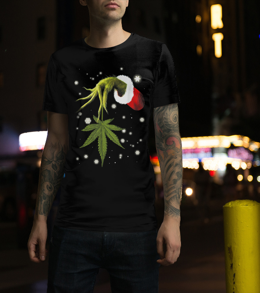 Grinch Hand Holding Cannabis Leaf With Santa Hat And Snowflakes T-Shirt