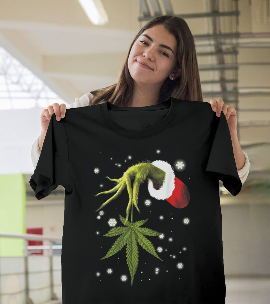 Grinch Hand Holding Cannabis Leaf With Santa Hat And Snowflakes T-Shirt