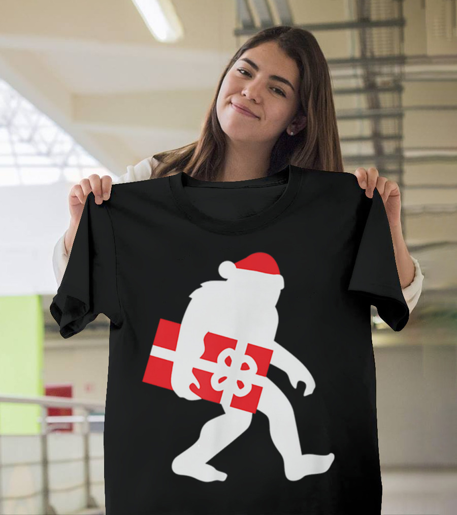 Nice Bigfoot Carrying Christmas Gift in Santa Hat T-Shirt