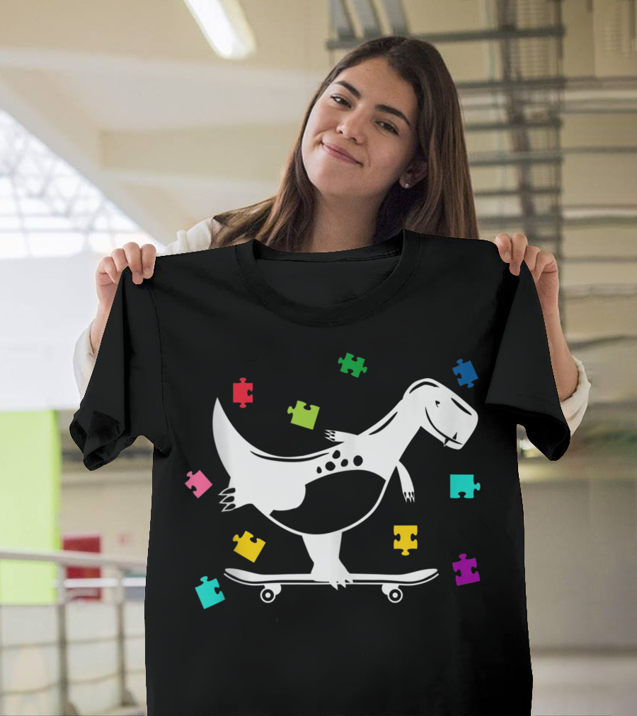 Autism Awareness Dinosaur Skateboarding with Colorful Puzzle Pieces T-Shirt