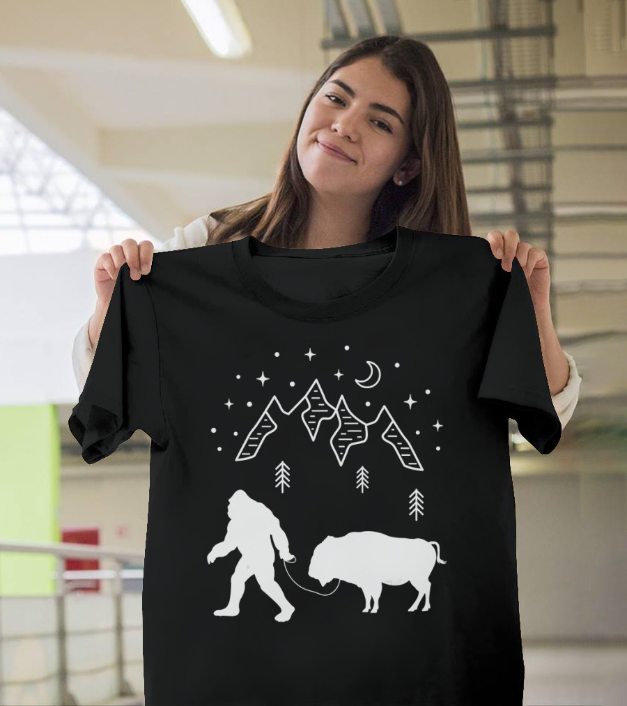 Bigfoot Walking a Buffalo Under Starry Mountain Sky T-Shirt