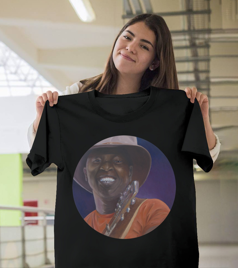 Ali Farka Toure Smiling Portrait with Guitar in Hat and Orange T-Shirt