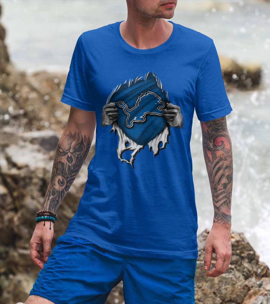 Torn DETROIT LIONS Logo Revealed Through Ripped Blue Fabric T-Shirt