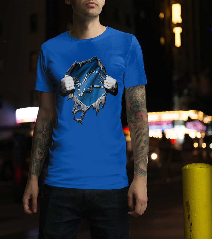 Torn Skin Revealing Detroit Lions Emblem On Blue T-Shirt