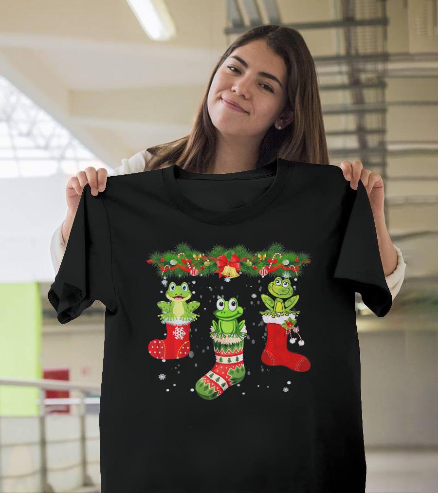 Three Frogs in Christmas Stockings Under Festive Garland with Santa Hat T-Shirt