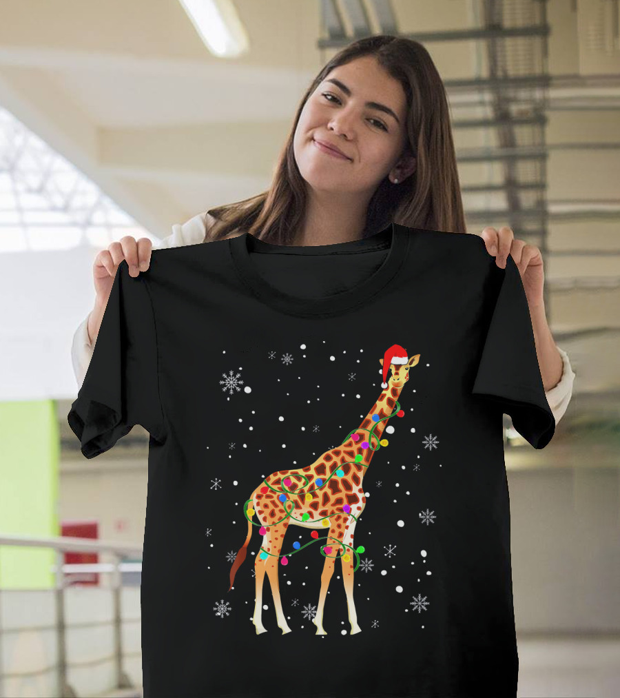 Giraffe Wrapped in Christmas Lights Wearing Santa Hat with Snowflakes T-Shirt