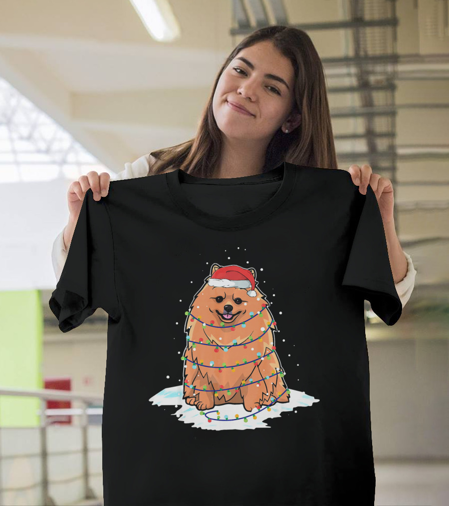 Pomeranian Santa Wrapped in Christmas Lights on Snowy Ground T-Shirt
