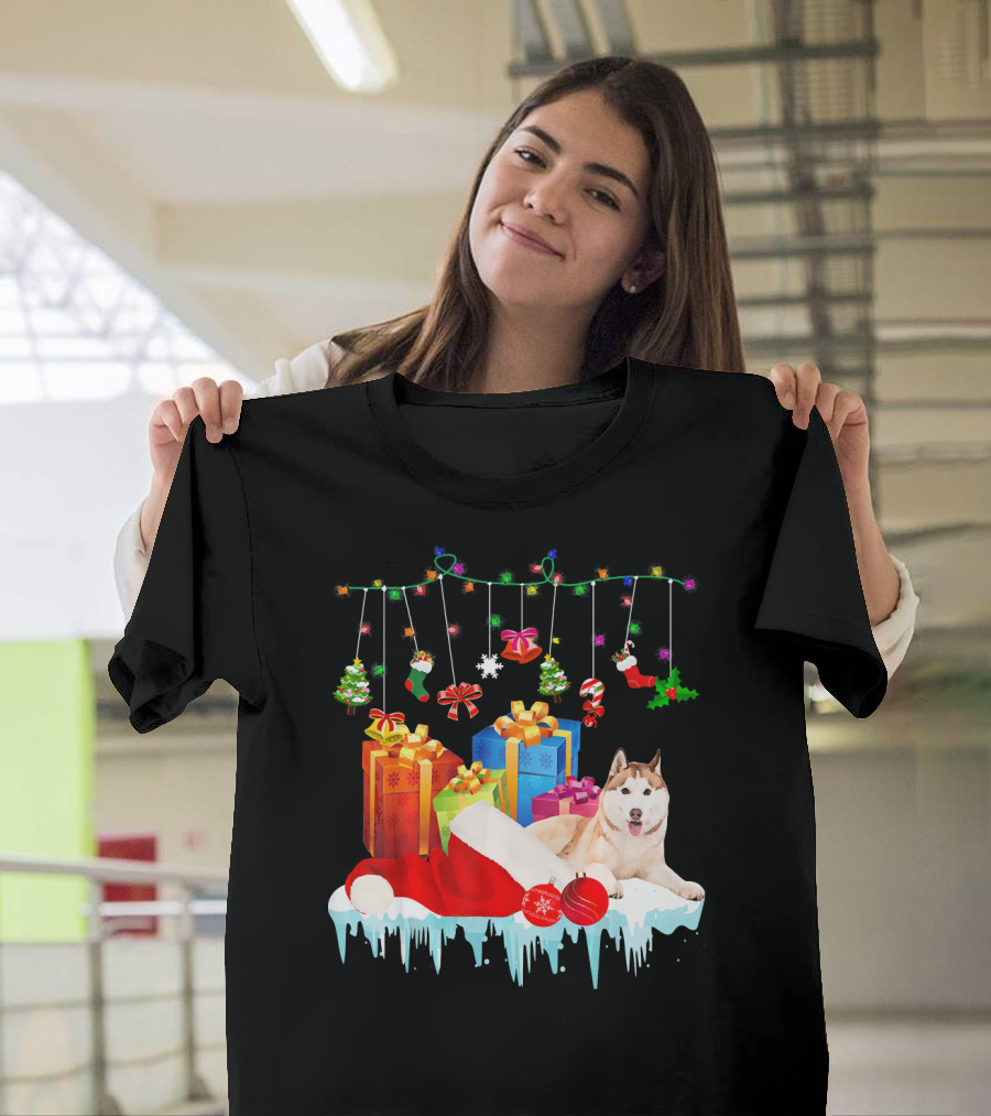 Husky with Santa Hat and Christmas Gifts Under Festive Holiday Decorations T-Shirt