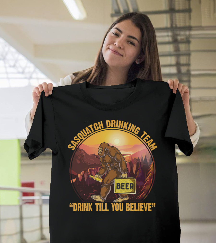 Sasquatch Drinking Team Beer Wilderness Sunset Funny Bigfoot Drink Till You Believe T-Shirt