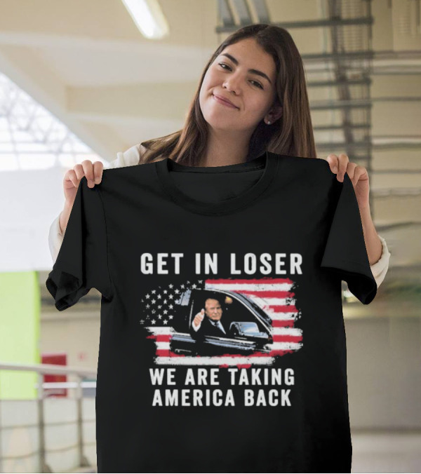 Get In Loser We Are Taking America Back Donald Trump Thumbs Up In Car With American Flag Background T-Shirt