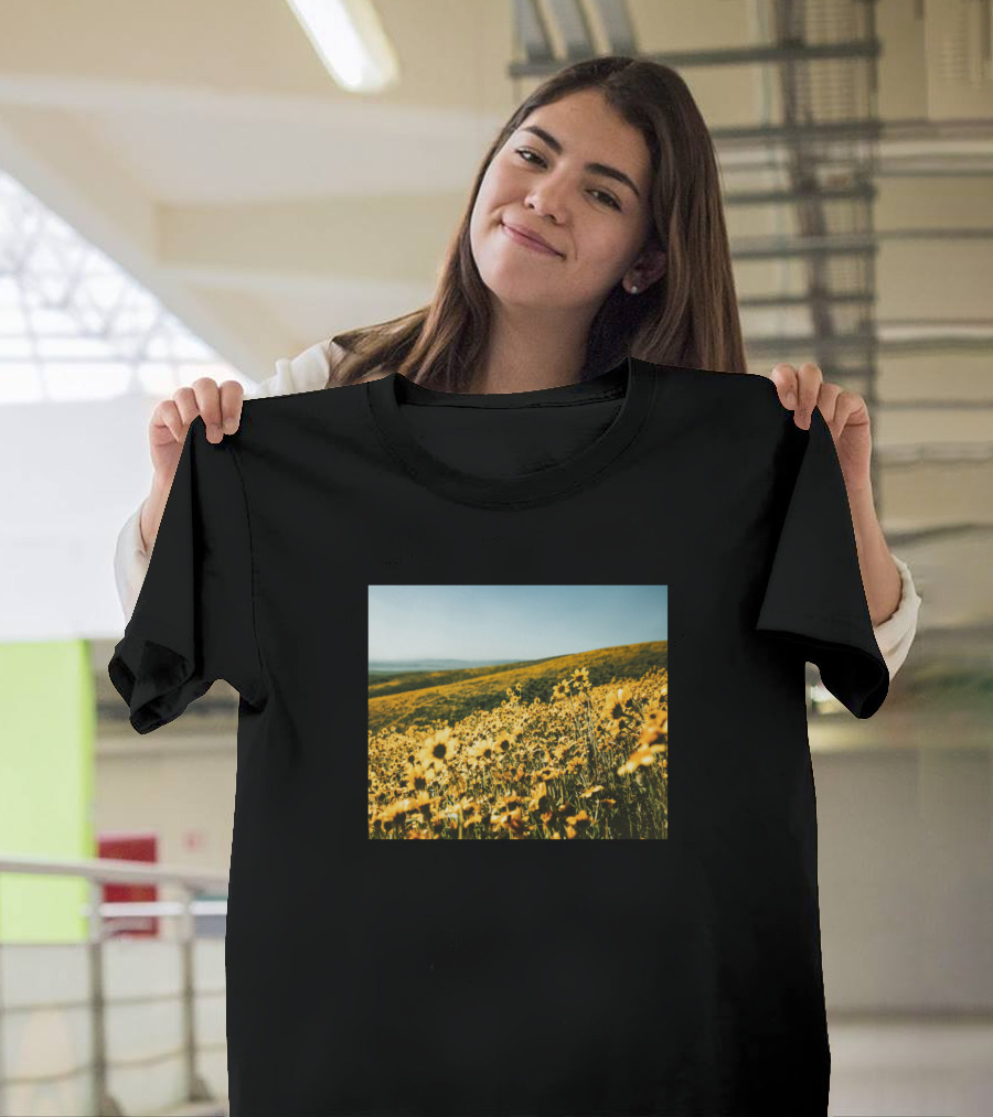 Beautiful View Of Daisy Field Pasture Near Grassy Hills In Blooming Meadow T-Shirt