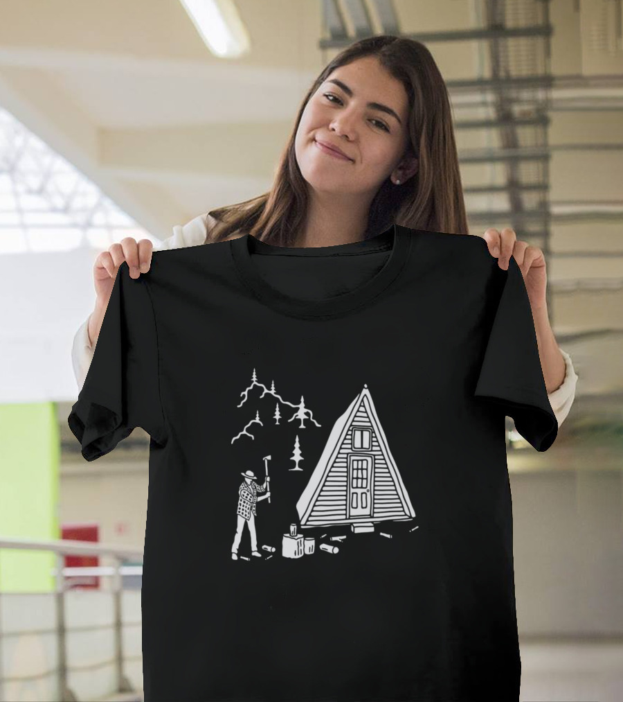 Man Chopping Wood by A-Frame Cabin in Forest Scene T-Shirt