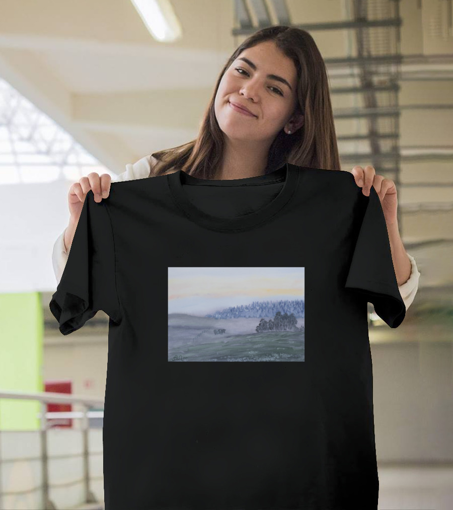A Cow in a Misty Landscape with Foggy Trees and Hills at Dawn T-Shirt