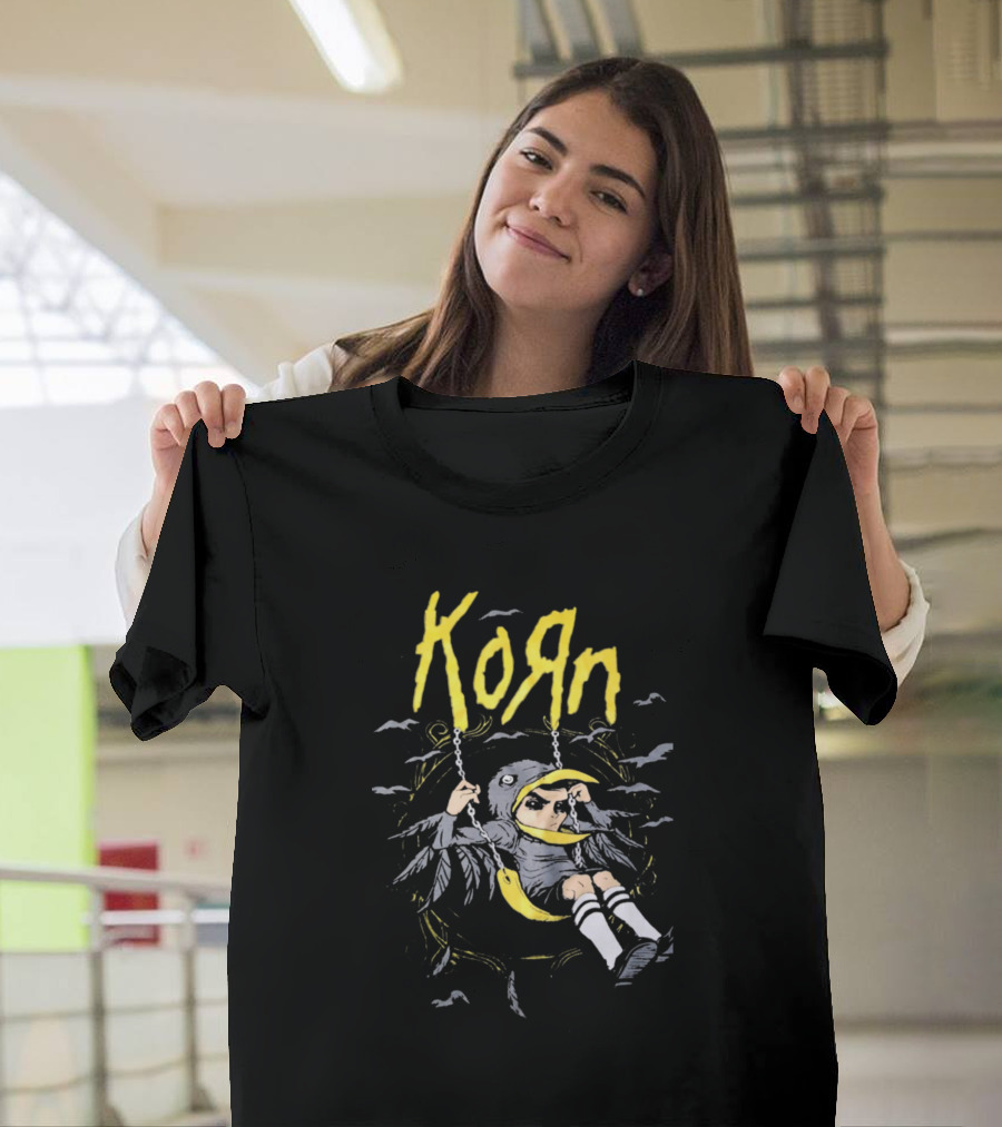 Korn Child in Bird Costume on Swing with Black and Yellow T-Shirt