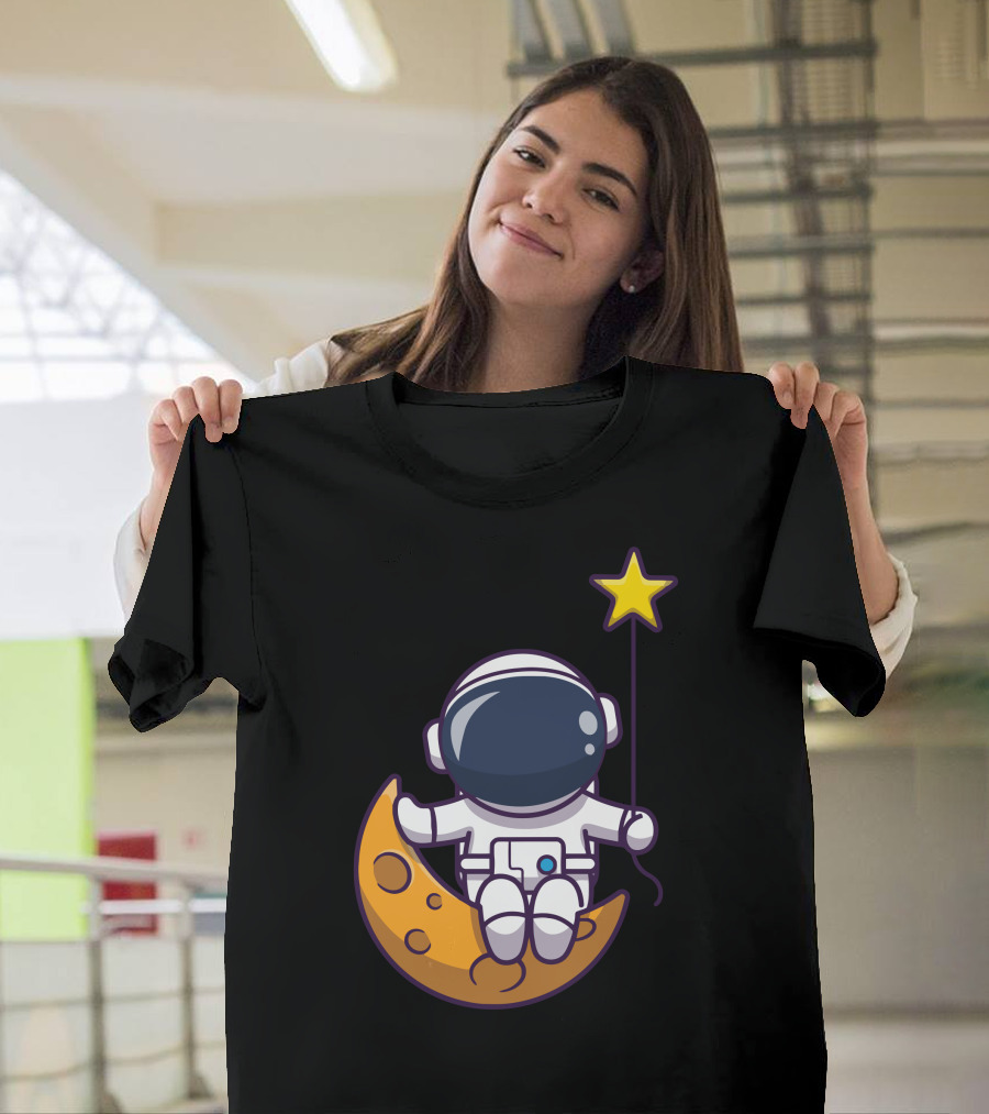 Astronaut Sitting on Moon Holding a Star Balloon T-Shirt