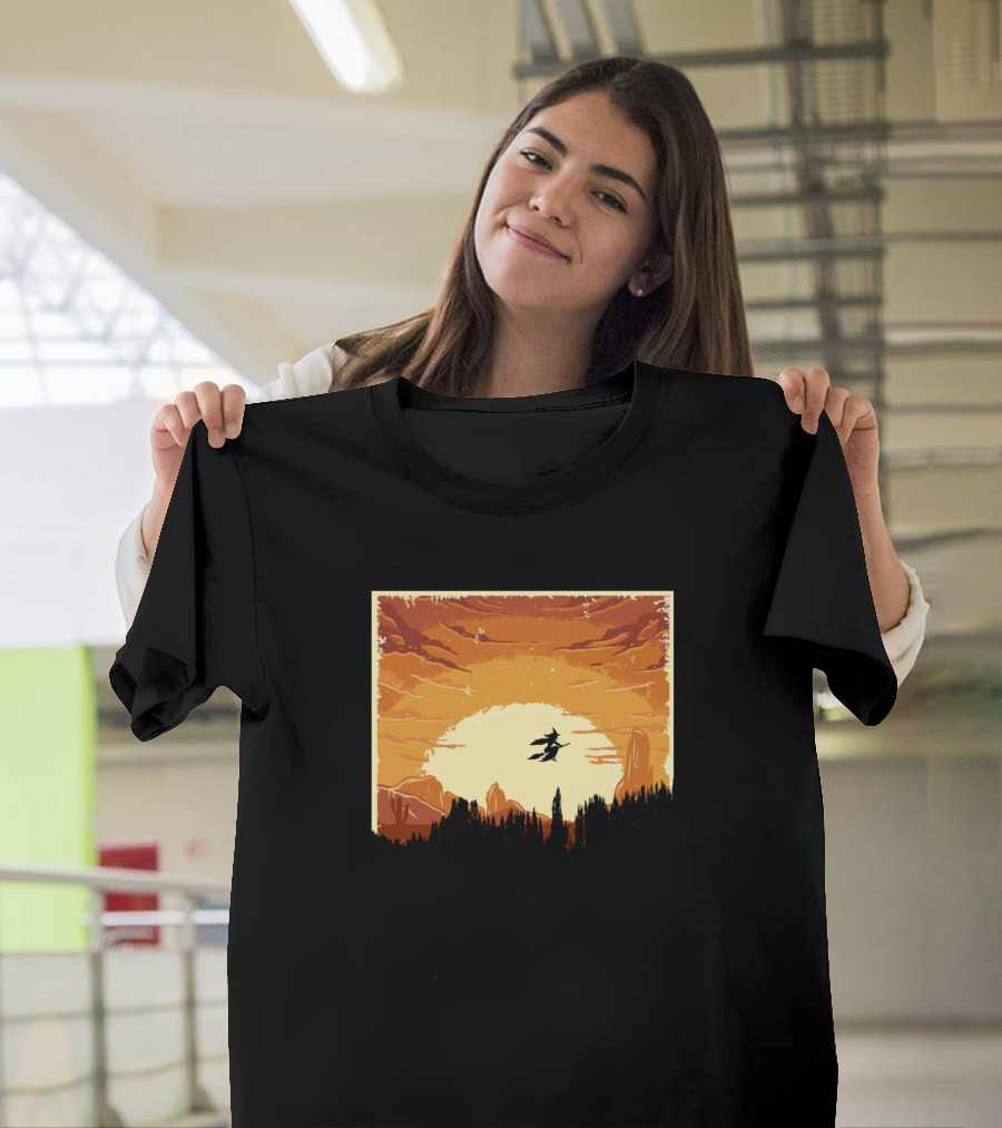 Flying Witch Silhouette Against Dramatic Sunset Sky T-Shirt