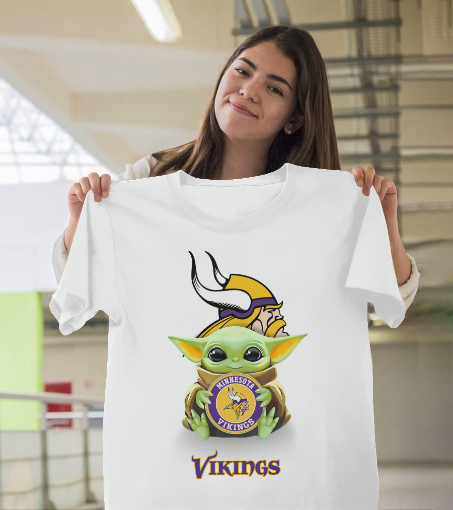 Grogu Holding Minnesota Vikings Symbol With Viking Helmet Background T-Shirt