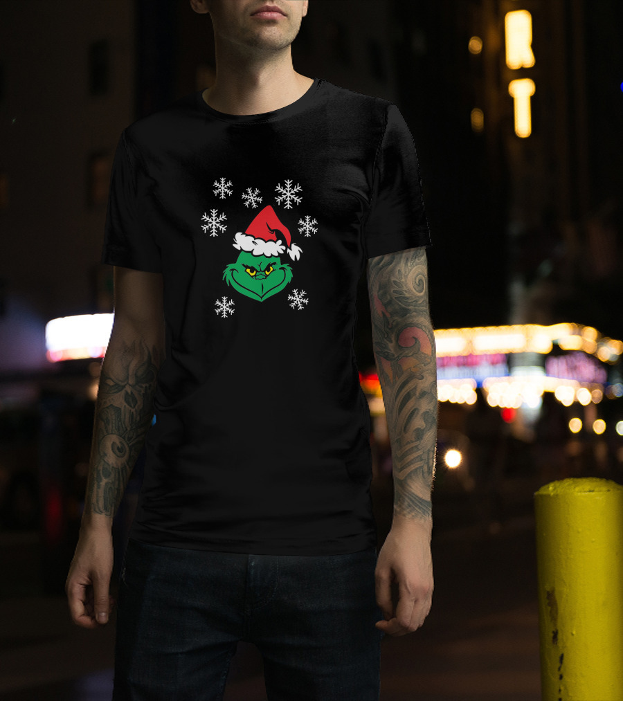 Grinch Face With Santa Hat Surrounded By Snowflakes Iconic Holiday Character T-Shirt