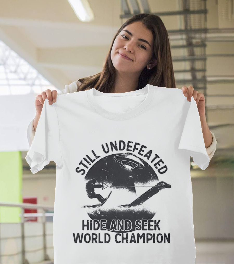 Still Undefeated Hide And Seek World Champion Bigfoot Riding Loch Ness Monster T-Shirt
