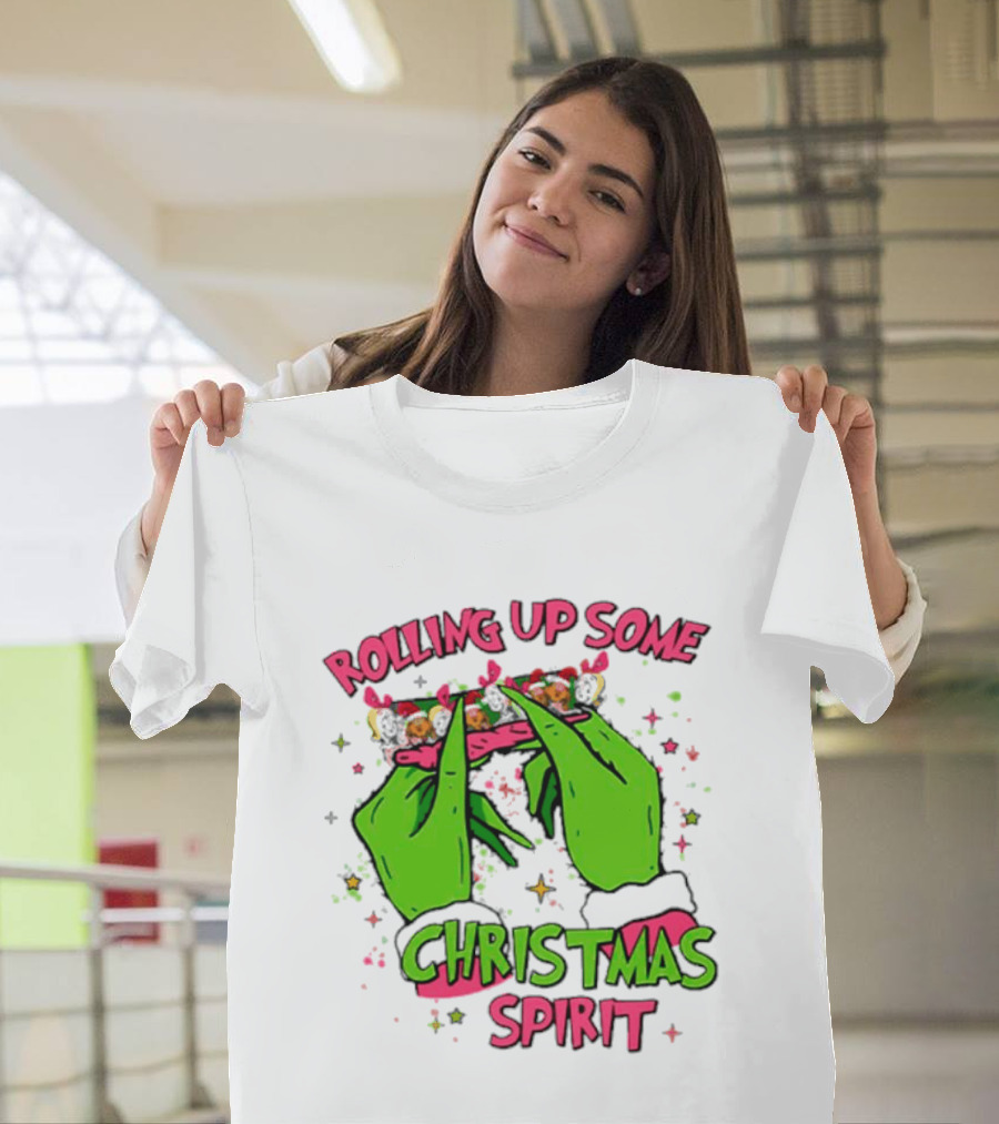 Grinch Rolling Up Some Christmas Spirit With Green Hands And Glitter Stars T-Shirt