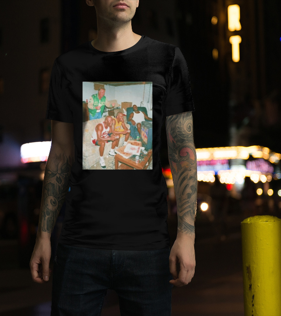 {"title":"Larry Bird Celtics Jacket Ing Michael Jordan Kobe Bryant Playing Video Game On Couch"} T-Shirt