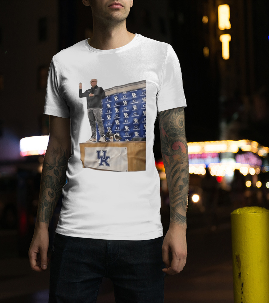 UK Volleyball Coach Craig Skinner Standing On Table With UK Logo And Awards T-Shirt