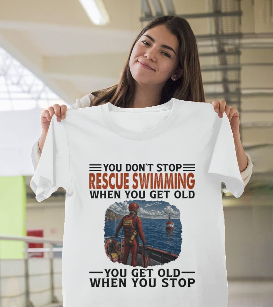You Don't Stop Rescue Swimming When You Get Old You Get Old When You Stop Rescue Swimmer Standing On Boat Near Lighthouse T-Shirt