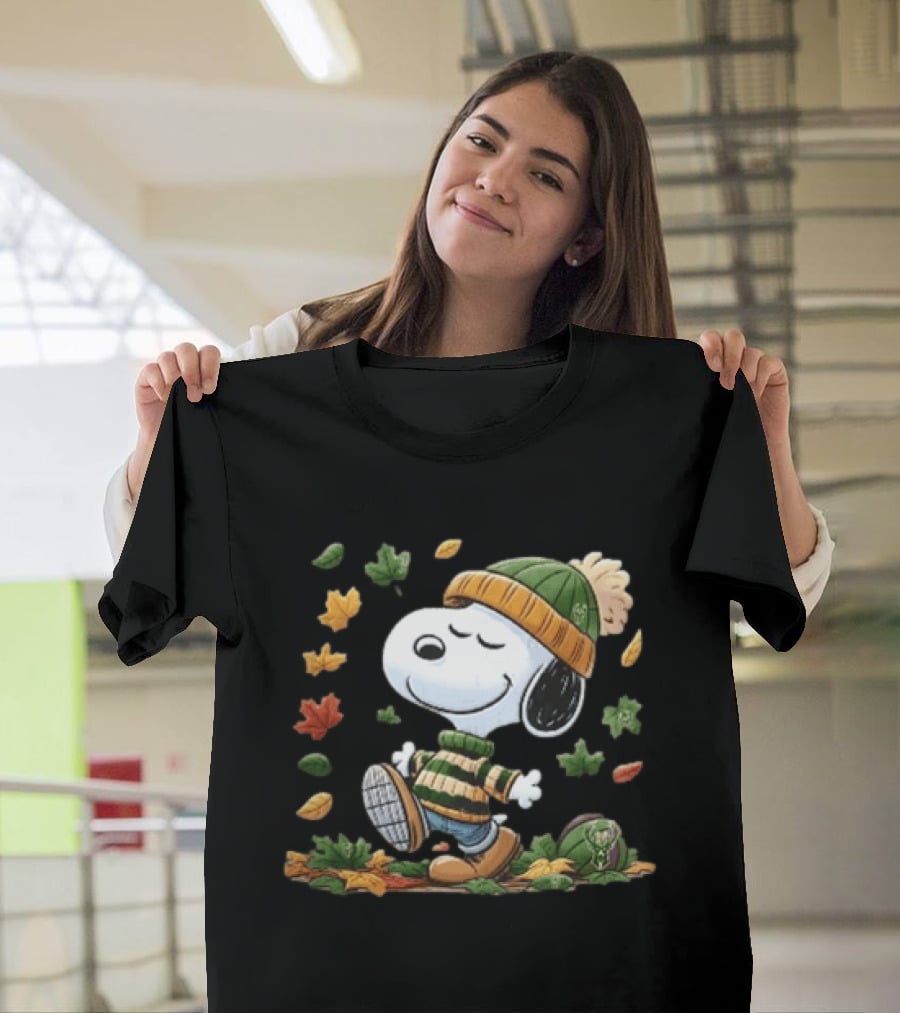 Milwaukee Bucks Snoopy In Beanie Walking Through Autumn Leaves Cartoon T-Shirt