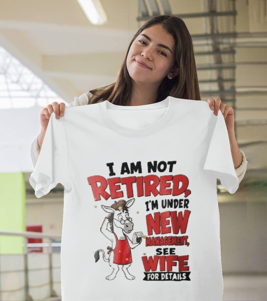 I Am Not Retired I'm Under New Management See Wife For Details Cartoon Donkey Red Apron T-Shirt