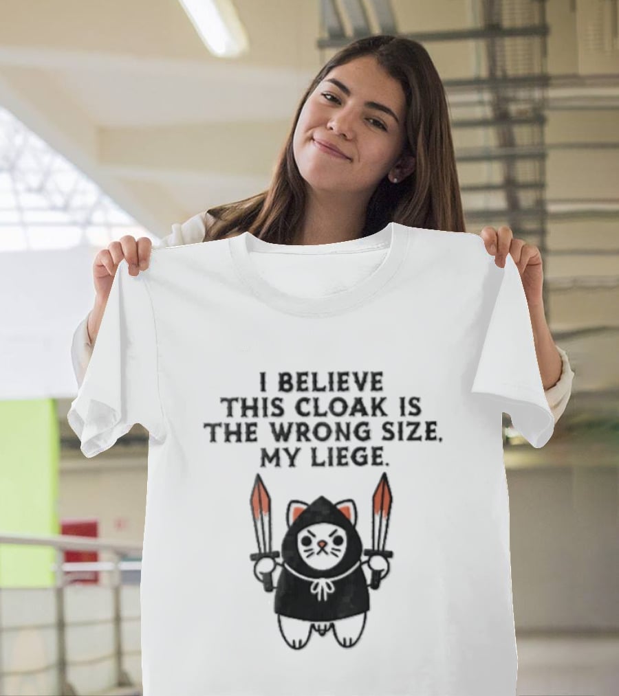 I Believe This Cloak Is The Wrong Size My Liege Cartoon Cat Holding Bloody Swords T-Shirt