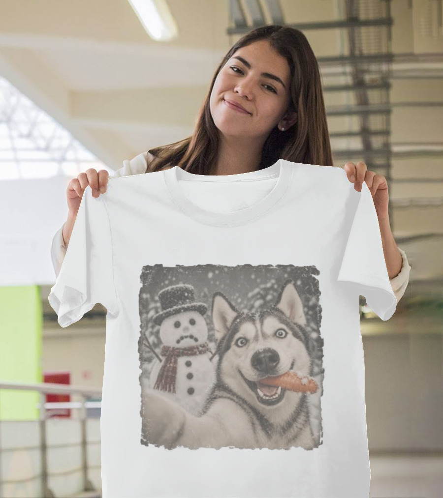 A Sled Dog With A Carrot And A Sad Snowman In A Snowy Winter Scene T-Shirt