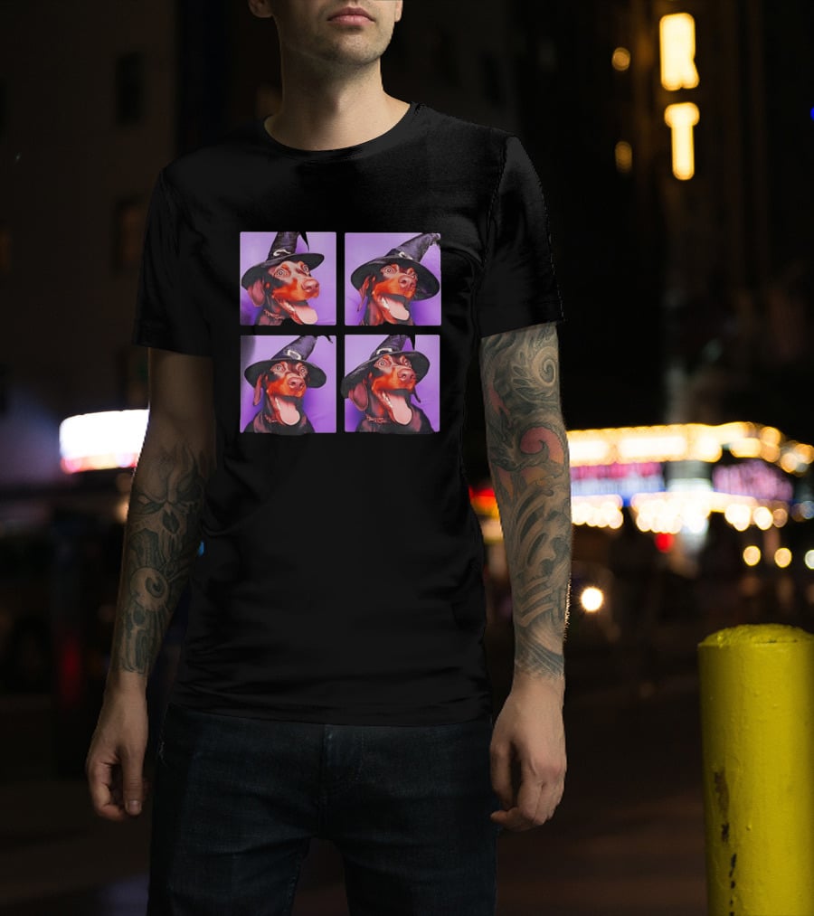 Doberman Pinscher In Witch Hat For Halloween With Purple T-Shirt
