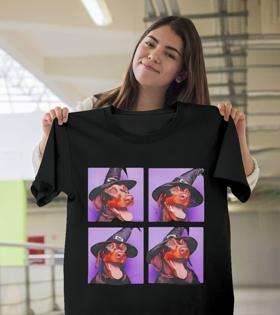 Doberman Pinscher In Witch Hat For Halloween With Purple T-Shirt