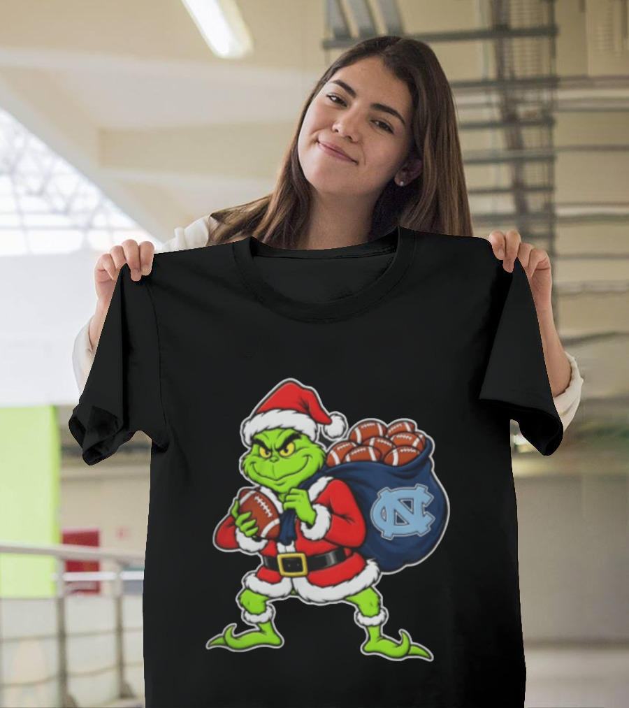 Grinch Santa North Carolina Tar Heels Holding Chiefs Footballs Christmas T-Shirt