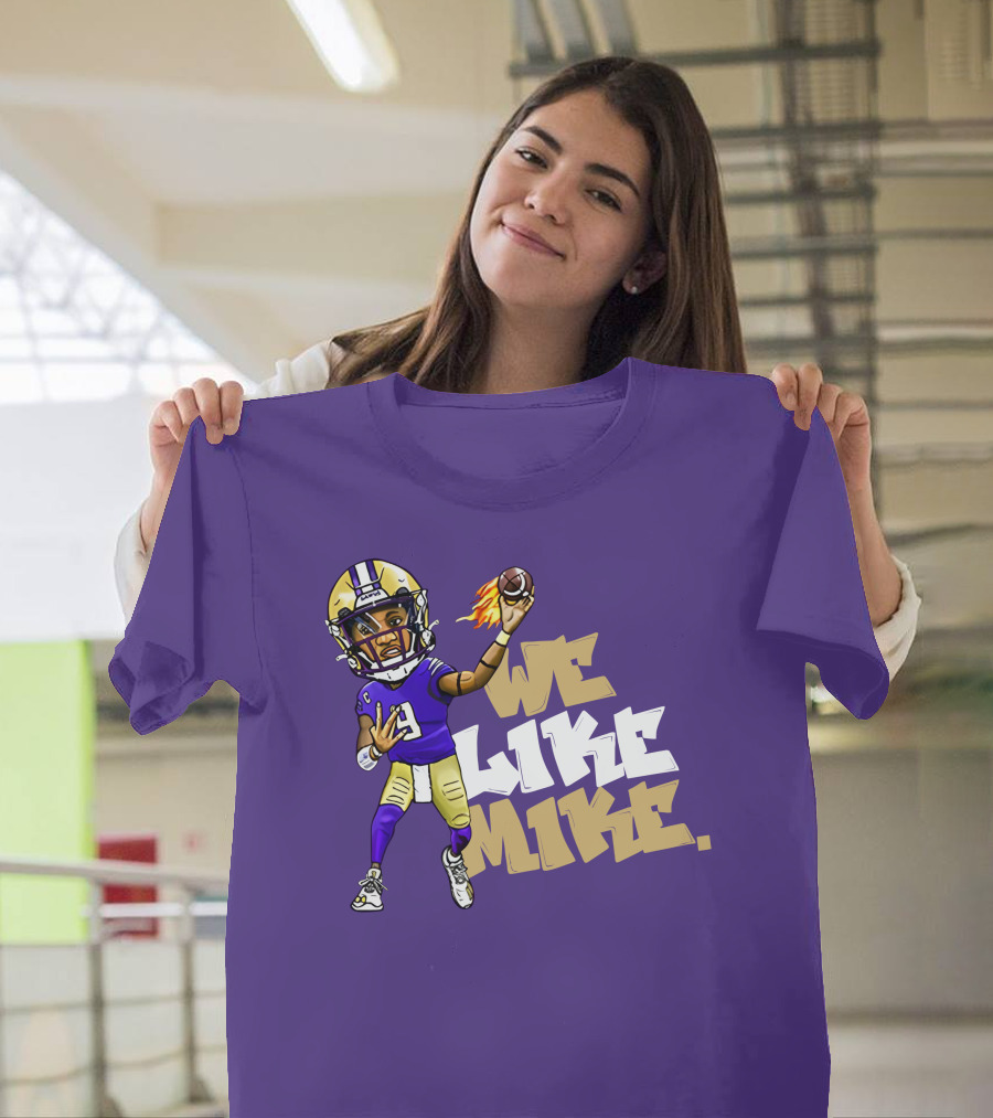 We Like Mike Football Character in Purple and Gold Gear Holding Flaming Ball T-Shirt