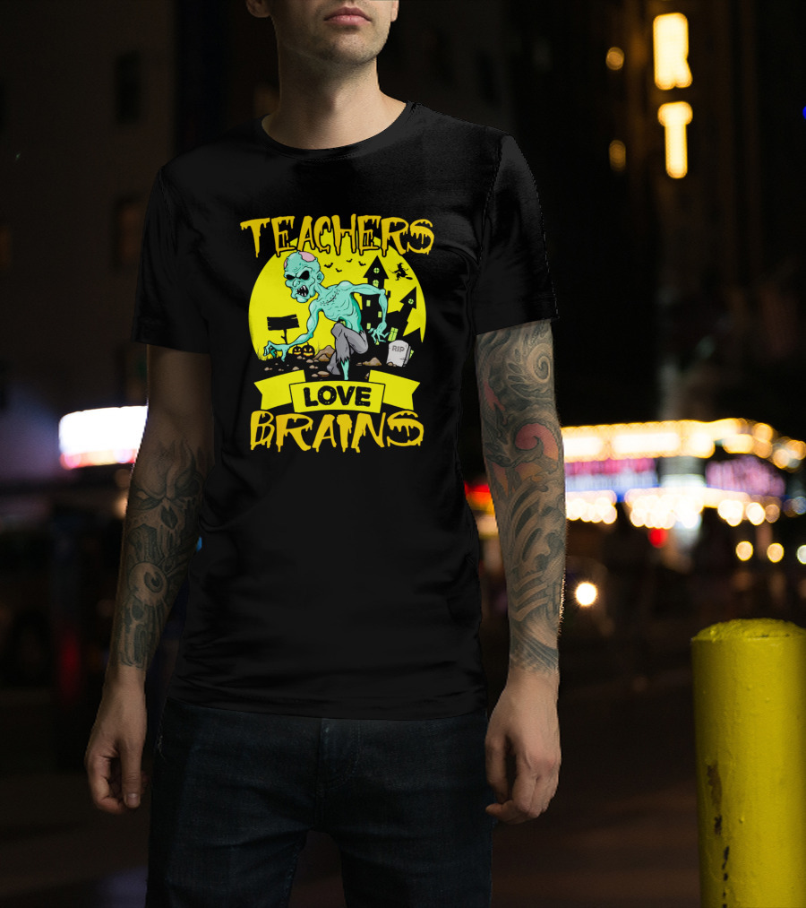 Teachers Love Brains Zombie Halloween Theme With Haunted Houses And Graveyard Background T-Shirt