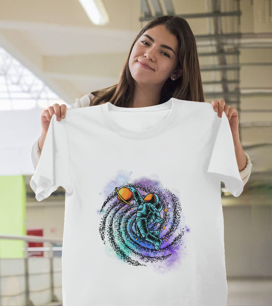 Astronaut Grasping Saturn In Cosmic Swirl 'Conquer The Universe' T-Shirt