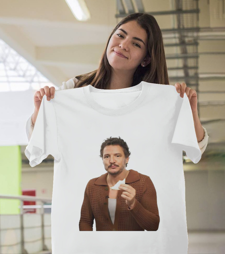 Pedro Pascal Holding Sandwich in Brown T-Shirt
