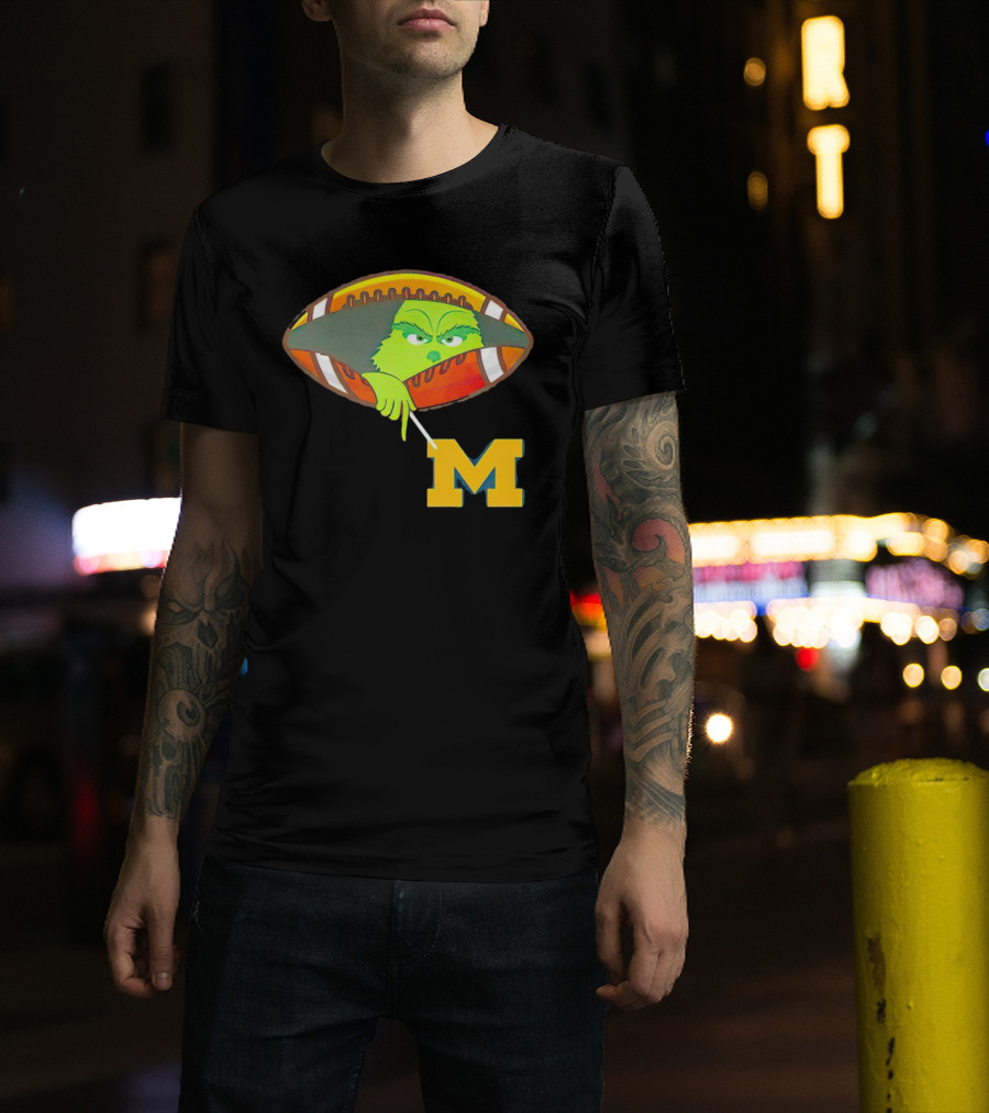 Grinch Peeking From Football Over Michigan Wolverines T-Shirt