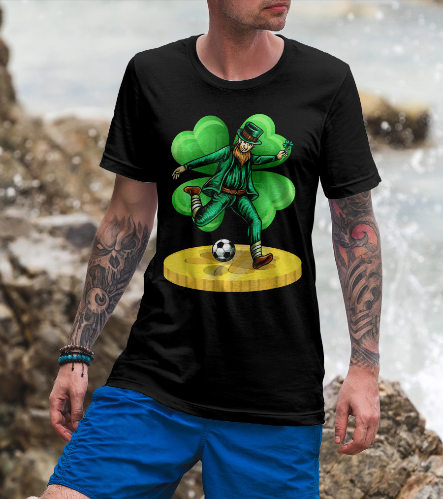 Leprechaun Kicking Soccer Ball On Gold Coin With Shamrock Background T-Shirt