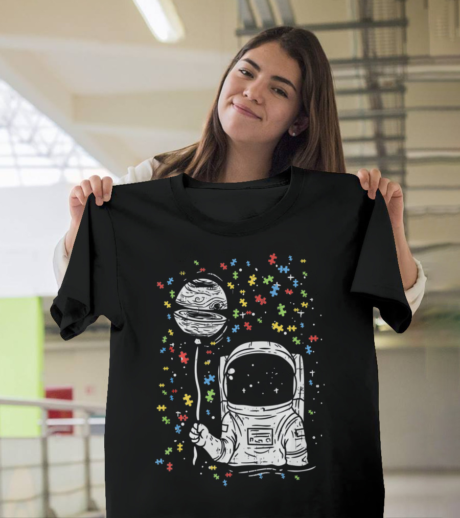 Astronaut Holding Planet Balloon with Puzzle Pieces for Autism Awareness T-Shirt