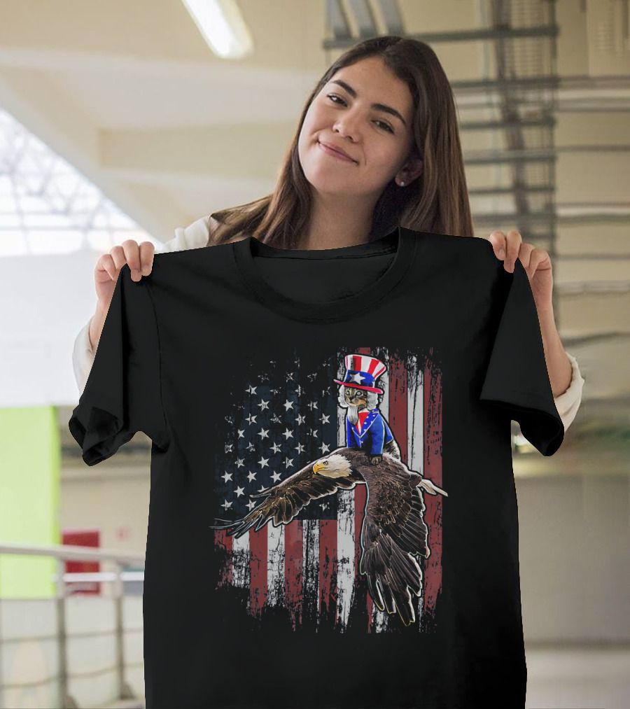 Uncle Sam Costume Cat Riding Bald Eagle On American Flag Background T-Shirt