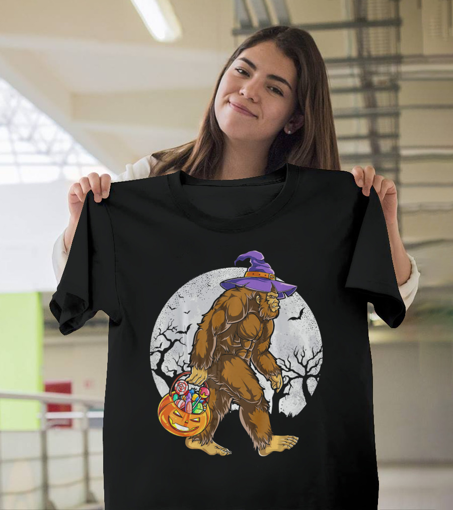 Bigfoot Witch Carrying Pumpkin Candy Basket In Spooky Moonlit Forest T-Shirt