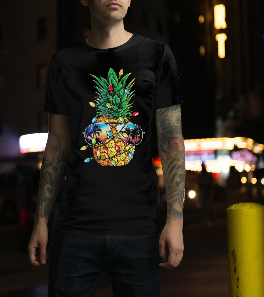 Pineapple Wrapped In Christmas Lights With Sunglasses Reflected Sunset And Palm Trees T-Shirt