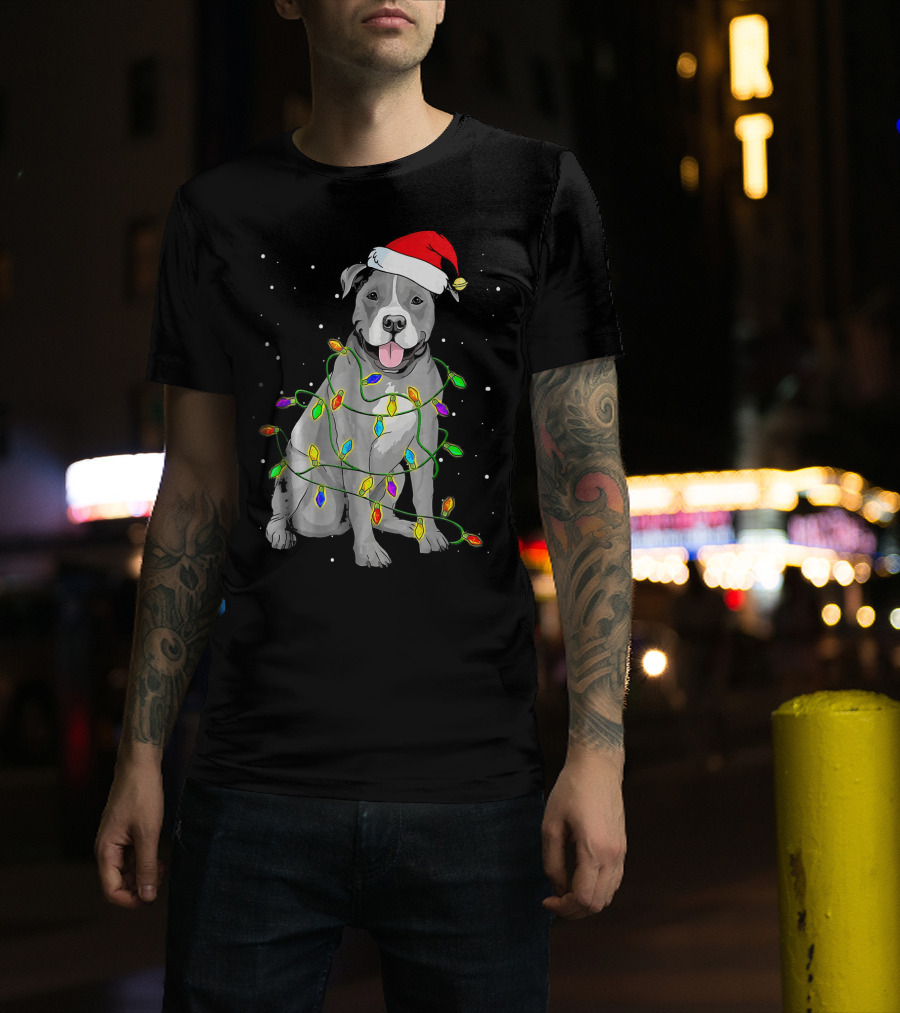 Pitbull In Santa Hat Wrapped In Christmas Lights With Snowy Background T-Shirt