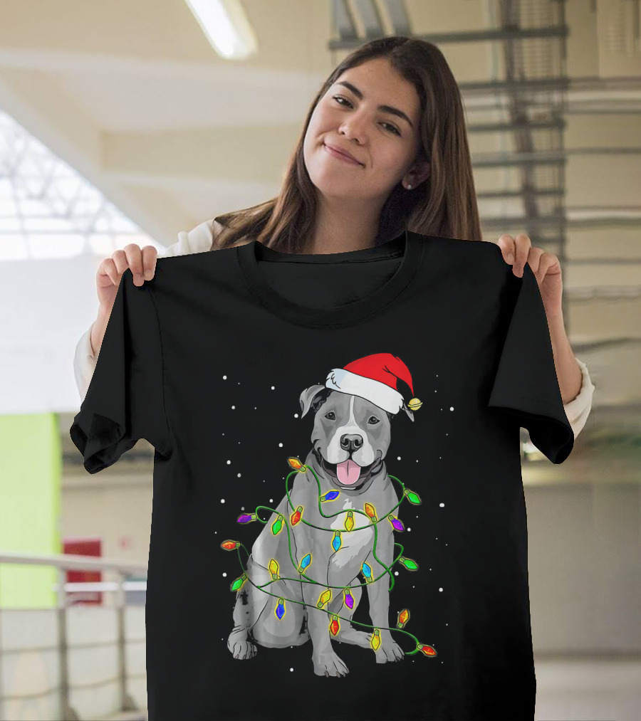 Pitbull In Santa Hat Wrapped In Christmas Lights With Snowy Background T-Shirt