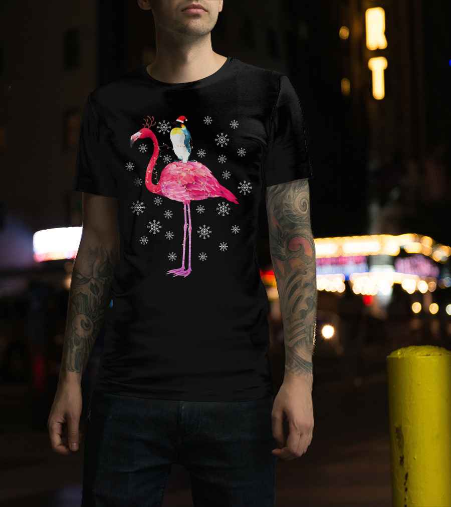 Penguin With Santa Hat Riding Flamingo With Antlers Surrounded By Snowflakes T-Shirt